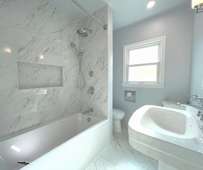 Bathroom remodel completed in San Pedro, CA using light colors to make the space appear larger. 