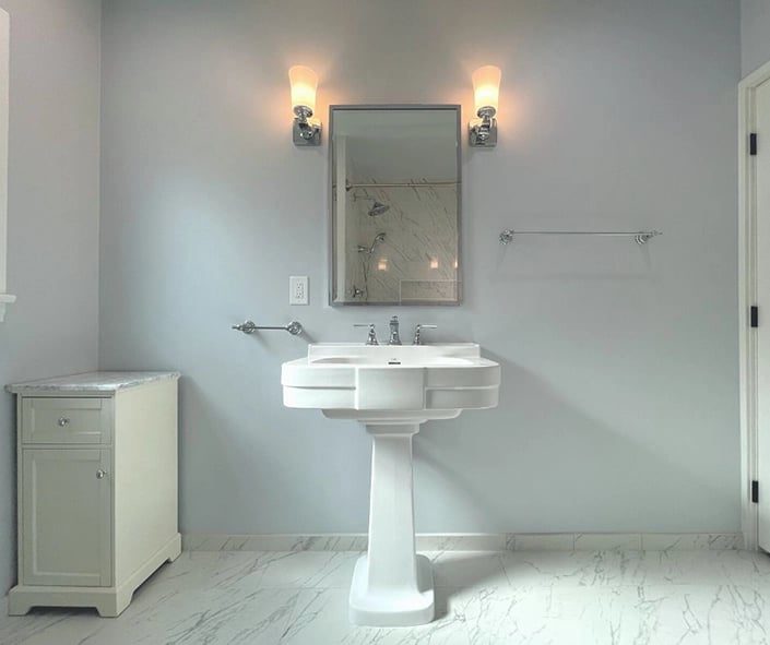 A clean bathroom remodel look with a classic pedestal sink "Bogart Basin" by Devon & Devon. 