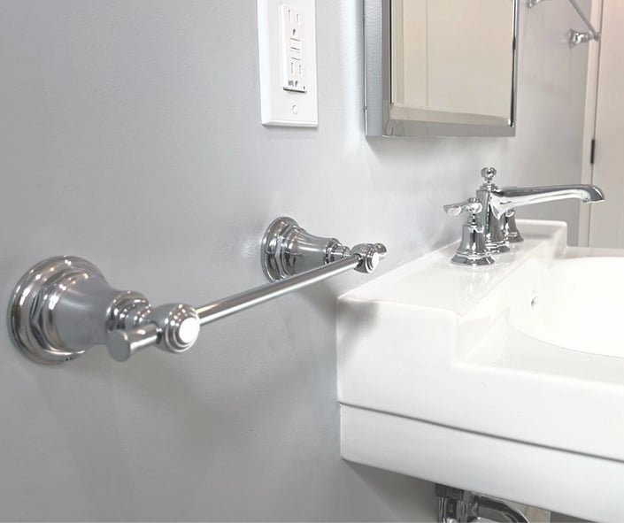 A close up look at the Brizo chrome towel bar used as a finishing touch in this bathroom remodel. 