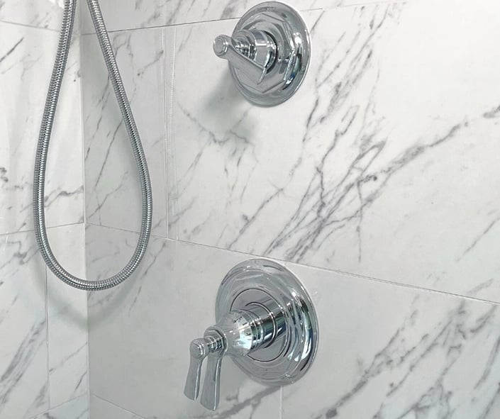 A close up look at the Brizo chrome shower valve used in this bath remodel.