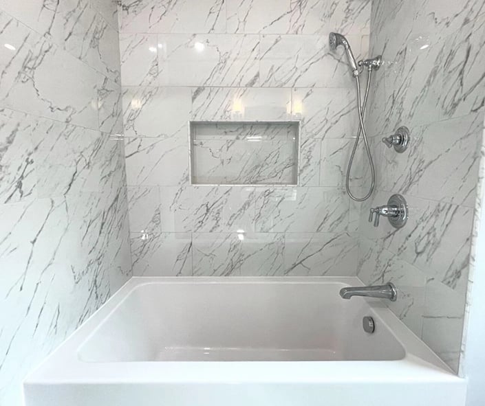 We installed a deep soaking tub and shower combo for maximum function and relaxation in this bathroom remodel.