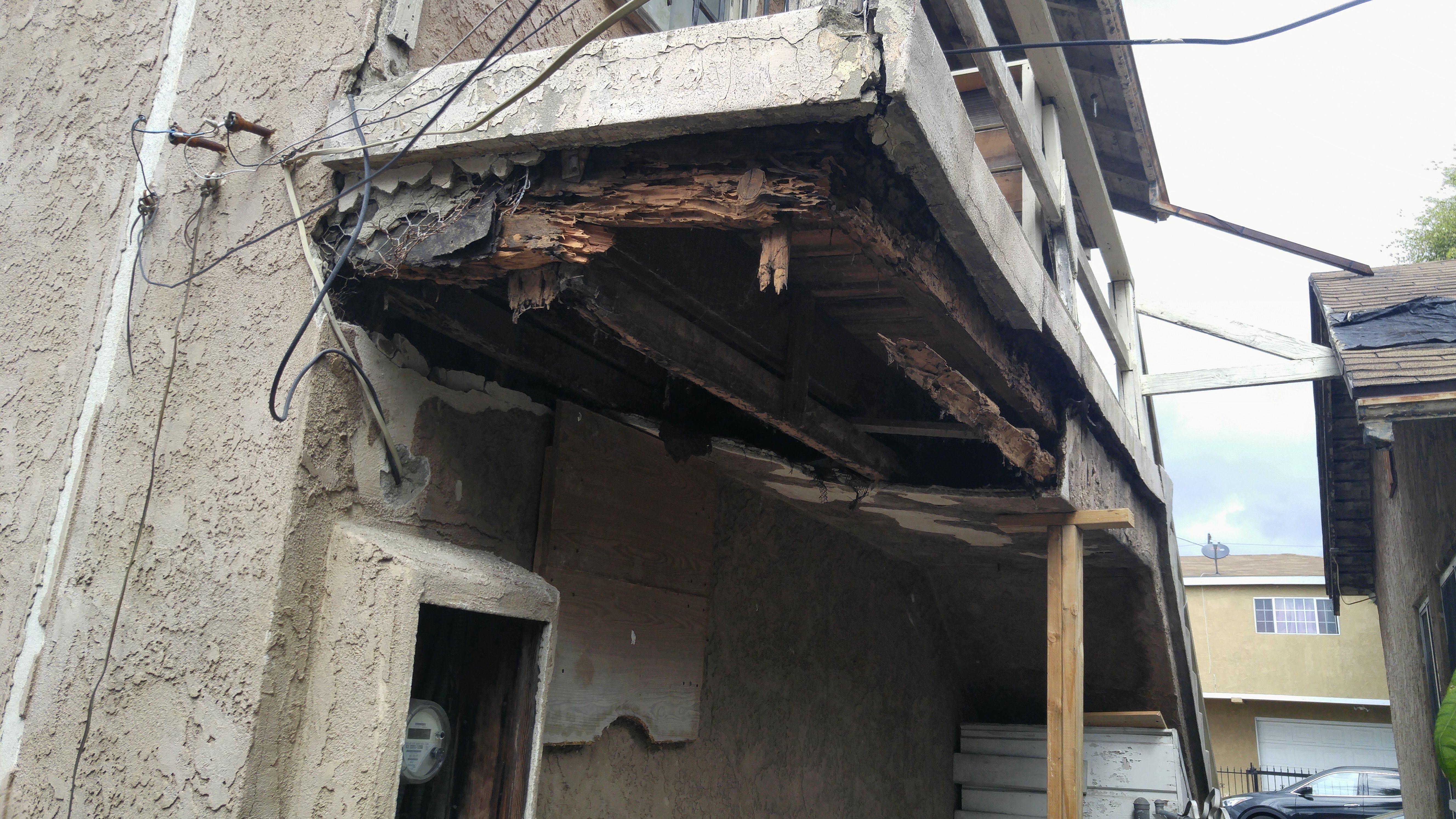Cantilevered walkway-dry rot damaged