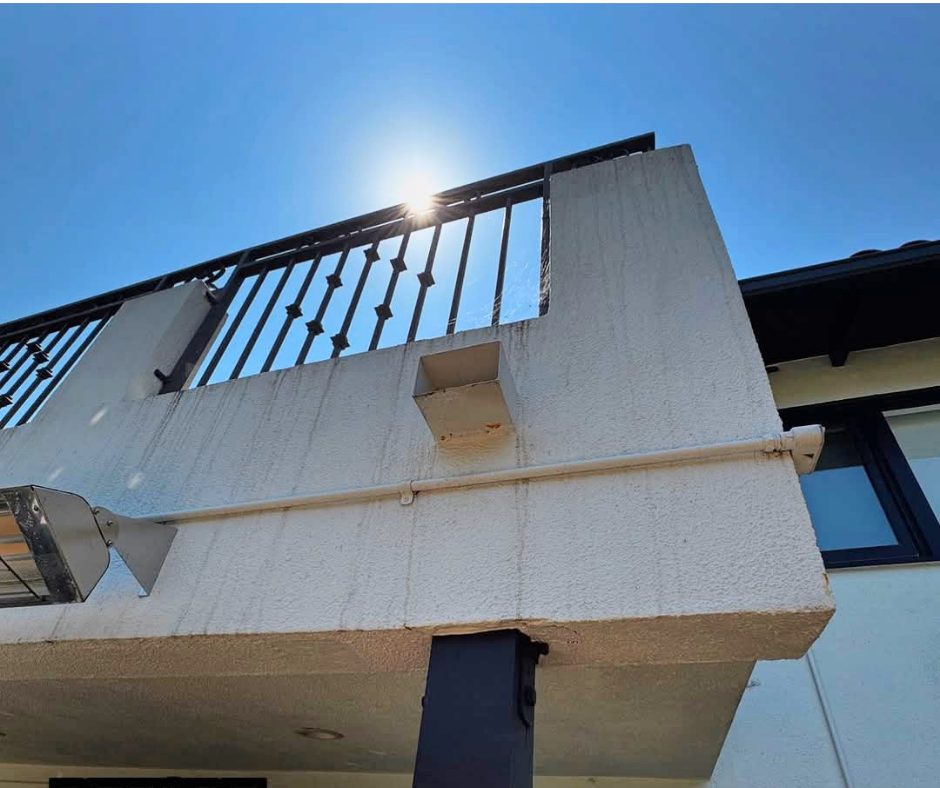 Balcony exterior before demo discovery showing minor visible damage